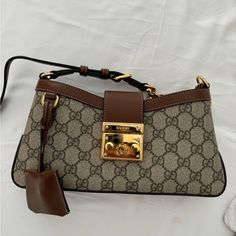 Just Bought This Bag In May!! Super Cute And Spacious, In Completely New Condition, I Didn’t Have The Opportunity To Wear It Yet. Comes With Box, Dust Bag, Authentication Card And All The Accessories. It Has A Key And Pochette Letting You Lock The Bag. Looks Really Cute On, And Has No Defects Or Cuffing. Brown Gucci Shoulder Bag With Detachable Handle, Gucci Small Padlock Bag, Gucci Shoulder Bag With Turn-lock Closure For Office, Gucci Padlock Bag, Luxury Gucci Bags With Turn-lock Closure, Gucci Padlock, Brown Gucci Shoulder Bag With Turn-lock Closure, Small Shoulder Bag, Gucci Bag