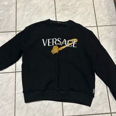 Worn Once Luxury Black Sweatshirt With Embroidered Logo, Black Luxury Sweatshirt With Letter Print, Designer Black Sweatshirt With Embroidered Logo, Luxury Crew Neck Sweatshirt With Letter Print, Luxury Black Cotton Sweatshirt, Luxury Logo Print Tops For Fall, Luxury Black Sweatshirt For Fall, Luxury Long Sleeve Tops For Streetwear, Versace Tops