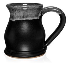 a black and white ceramic pitcher on a white background