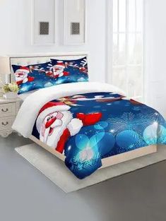 a bed with santa clause on it and christmas decorations