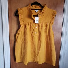 Size Large. 22 A To A. 25l In Back From Lower Collar To Hem. Dark Mustard Yellow Color. From The Reimagined Collection. 100% Cotton, Super Soft! Crinkled. Small Ruffle Around Arm & Neckline. 3/4 Button Down. Casual Mustard Cotton Blouse, Mustard Relaxed Fit Tops For Summer, Yellow Cotton Top For Workwear, Yellow Cotton Top For Work, Mustard Sleeveless Cotton Top, Yellow Relaxed Fit Top For Work, Sleeveless Mustard Cotton Tops, Yellow Summer Tops For Workwear, Mustard Cotton Top For Spring