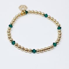 Our handmade Beaded Birthstone Bracelet is the personalized accessory, crafted with classic gold-filled or sterling silver round beads, the sparkling birthstone crystals add a colorful, timeless touch to your look. With 13 birthstone options, it's perfect for stacking or wearing solo and can be customized to represent your family and loved ones. Made with a balanced blend of 4mm metal beads and colorful birthstones, it's a beautiful yet subtle way to honor those close to your heart. Arrives gift 14k Gold Filled Birthstone Bracelets, 14k Gold-filled Birthstone Bracelets, Gold Birthstone Bracelet In 14k Gold Filled, Adjustable Gold Sterling Silver Crystal Bracelet, Gold Sterling Silver Adjustable Crystal Bracelet, Elegant Gold Beaded Bracelets With May Birthstone, Elegant Gold Crystal Bracelet With Birthstone, Elegant Gold Crystal Bracelet Personalized, Elegant Gold Crystal Birthstone Bracelet