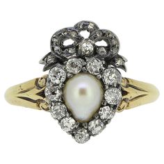 an antique pearl and diamond cluster ring