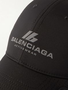 Part of the AW24 collection, Balenciaga's baseball cap has a signature notched brim and is printed with reflective branding across the front. Made in Italy from hard-wearing drill, it has embroidered eyelets and an adjustable back tab for a customisable fit. Designer Baseball Cap For Streetwear, Designer Baseball Cap With Curved Brim For Streetwear, Designer Curved Brim Baseball Cap For Streetwear, Designer Streetwear Cap, Sporty Logo Print Baseball Cap, Sporty Baseball Cap With Logo Print, Sporty Curved Brim Hat With Logo Print, Sporty Visor Hat With Logo Print, Streetwear Baseball Cap With Logo And Curved Visor