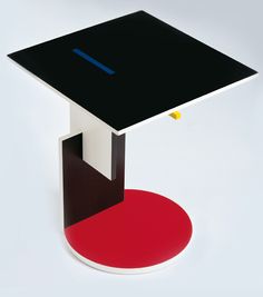 a black and white table sitting on top of a red circle