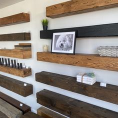 some wooden shelves are lined up against the wall