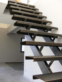 the stairs are made of wood and metal