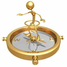 a golden man standing on top of a gold compass