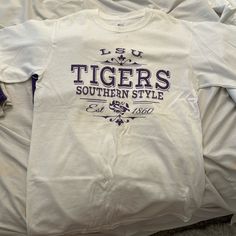 Lsu Tigers White Cotton T-Shirt Size Small Great Condition. Never Worn Graphic Print Is In Great Condition White Relaxed Fit T-shirt For College, White Relaxed Fit Shirt For College, White Relaxed Fit Top For College, White Pre-shrunk College T-shirt, White Graphic Tee For College, Lsu Shirt, Lsu Tigers, Garment Bags, Barnes And Noble