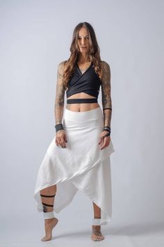 NEW asymmetric wide leg pants and skirt/Cotton High waisted plus size skirt/Edgy ankle length loose pants/Cyberpunk, palazzo pants My absolute fav design this year ! High waisted skirt made of cotton to have a perfect fit and flowy feeling ! Two pieces wrapped together create asymmetrical design ,hem touching the ankle and the highlight of course of the design ...the ankle cuffs that are attached to the skirt with buttons and transform the skirt into pants ! You can remove them and use them on o Baggy Asymmetrical Pants For Spring, White Asymmetrical Bottoms For Spring, Edgy Fitted Bottoms With Asymmetrical Hem, Edgy Wide Leg Summer Pants, Asymmetrical Flowy Skirt For Summer, Versatile Fitted Harem Pants For Summer, Versatile Fitted Bottoms With Asymmetrical Hem, Asymmetrical Baggy Bottoms For Spring, Versatile Asymmetrical Bottoms For Spring