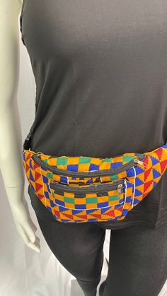 Crafted  with vibrant Kente fabric, this stylish fanny bag features three zipper pockets for convenient storage of your essentials. The adjustable waistband ensures a perfect fit, combining fashion and functionality seamlessly. Elevate your style with this unique and culturally inspired Fanny Pack. Casual Multicolor Pouch Belt Bag, Multicolor Belt Bag With Pockets For Everyday Use, Multicolor Zipper Pouch Belt Bag For Travel, Casual Multicolor Chest Bag For Travel, Trendy Multicolor Pouch Belt Bag, Kente Fabric, Kente Print, Fanny Bag, Hair Bonnet