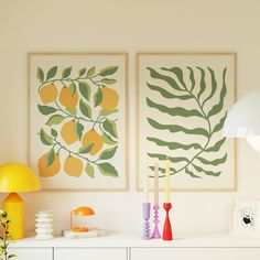 there are two paintings on the wall next to each other, one is yellow and green