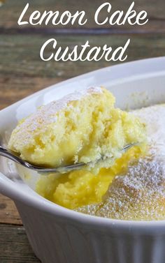 lemon cake custard with powdered sugar in a white bowl on a wooden table