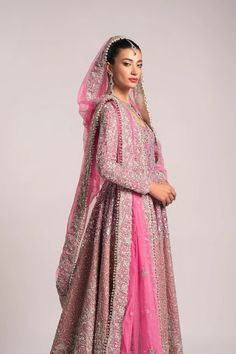 Pink Pakistani Bridal Dress in Pishwas Frock Style is embellished with beautiful zardosi, sequins, crystals, and embroidery work. Premium quality fabric and perfect stitching make this Pakistani Wedding Dress your foremost priority for the most important day of your life. Traditional Semi-stitched Embellished Gown, Anarkali Hand Embellished Semi-stitched Dress, Kundan Anarkali Dress For Wedding, Bollywood Style Hand Embellished Gown For Eid, Semi-stitched Kundan Gown With Intricate Embroidery, Anarkali Hand Embellished Gown For Designer Wear, Anarkali Designer Wear Gown Hand Embellished, Reception Organza Salwar Kameez Hand Embellished, Hand Embellished Chinon Anarkali Set For Reception