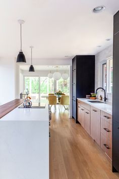 the kitchen is clean and ready to be used as a dining room or living room