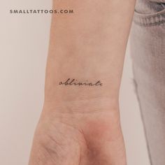 a small tattoo on the wrist that reads, olliania