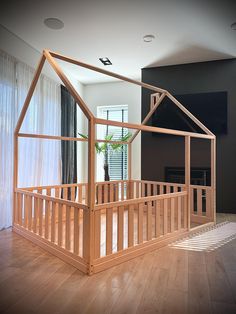 a house made out of wood on top of a hard wood floor