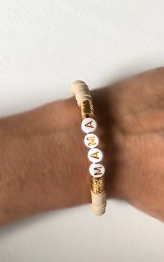 "Orders will be shipped next week and can not be ready for Mother s day. Custom Heishi bracelets are beautiful gift for everybody. 6 mm. Heishi beads in different colors, brushed gold plated discs and custom name will be used or you can prefer no name. Gold plated plain bracelet looks very chic. ❣️To know your size please measure your wrist with a ribbon/string and measure this with a ruler. Add 0.25\". Size:6.25\" - 6.5\" - 6.75\" - 7\" - 7.5\" - 8\" Kid size is available such as 5.5\" and you Gold Heishi Beads Bracelets As Gift, Gold Heishi Beads Bracelet Gift, Gold Heishi Beads Name Bracelet As Gift, Personalized Gold Heishi Beads Stretch Bracelet, Personalized Gold Heishi Beads Bracelets, Customizable Gold Beaded Bracelets, Plain Bracelet, Heishi Bracelets, Heishi Bracelet