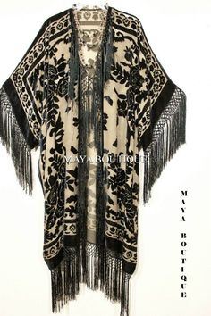 "DESCRIPTION : MADE IN USA BY MAYA Taupe & Black fringe kimono burrnout velvet jacket opera coat Cut in a Kimono style with hand knotted fringes down the front and around the hems One size Fits All - Free bust, 59\" hips, 44\" long (plus the 7\" fringes) Fits ALL sizes , UP to 5X (approximately-please measure yourself) We do have other designs & colors in the same style & also beaded Thanks for looking ! A TRUE WEARABLE ART!! Please note : The fabric in these caftans is high quality Velvet Fringe, Mode Kimono, Fringe Kimono, Velvet Kimono, Burnout Velvet, Kimono Duster, Flapper Style, Looks Street Style, Fringe Jacket