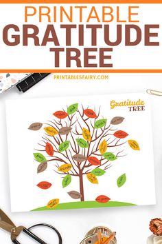 a printable thanksgiving tree is shown with scissors and other crafting supplies on the table