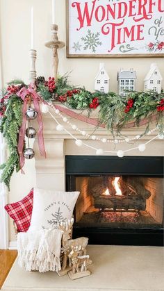 a fireplace decorated for christmas with stockings and garland on the mantel above it is a sign that says wonderful time