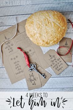 a piece of bread sitting on top of a table next to some tags and scissors