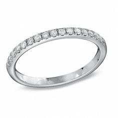 a white gold wedding band with rows of diamonds