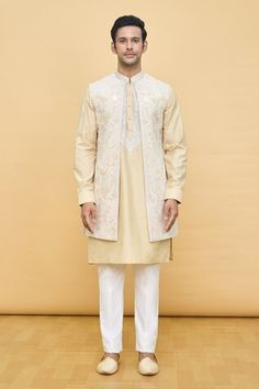 Yellow longline Nehru jacket with contrasting floral pattern aari tilla embroidery. Comes with embroidered placket kurta and pant. - Aza Fashions Straight Kurta Nehru Jacket With Zari Work For Spring, Spring Nehru Jacket With Zari Work, Straight Kurta Style, Embroidered Nehru Jacket For Reception, Straight Shape, Embroidered Nehru Jacket For Reception, Spring Nehru Jacket With Zari Work, Straight Kurta Nehru Jacket With Intricate Embroidery For Reception, Reception Nehru Jacket With Intricate Embroidery, Nehru Jacket With Intricate Embroidery For Reception, Spring Bandhgala With Chikankari Embroidery