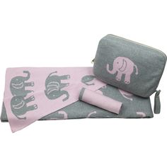 an elephant blanket and wallet are on display