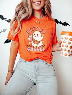 Bella+Canvas® Let's Go Ghouls, Spooky Vibes T, Retro Halloween, Ghost TShirt, Halloween Party T, Women's Halloween, Trendy Halloween, Fall T 👕 Our "let's go ghouls" t-shirt is the perfect way to flaunt your love for this time of year! Made from 100% airlume combed and ringspun cotton, these shirts offer unmatched comfort and softness, making them ideal for everyday wear. The tear-away label ensures irritation-free comfort, while the true-to-size fit guarantees a flattering silhouette for everyo Cute Orange Halloween T-shirt, Cute Orange Tops For Halloween, Cute Orange Top For Halloween, Orange Halloween Tops With Character Print, Halloween Orange T-shirt With Cartoon Print, Orange Halloween T-shirt With Cartoon Print, Orange Halloween Cartoon Print T-shirt, Lets Go Ghouls, Ghost Tshirt