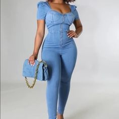 This Super Cute Super Stretchy Denim Jumpsuit Can Be Dressed Up Or Down For Any Occasion, Pair With Heels Or Flats. Short Sleeve Exaggerated Shoulders Blue Stretch Denim Jumpsuits And Rompers, Trendy Stretch Blue Denim Jumpsuit, Blue Denim Jumpsuit With Zipper Closure, Trendy Blue Stretch Denim Jumpsuit, Blue High Rise Stretch Jumpsuits And Rompers, Blue High-rise Stretch Jumpsuits And Rompers, Blue Stretch High Rise Jumpsuits And Rompers, Blue Stretch Denim Jumpsuit With Short Sleeves, Trendy Denim Jumpsuit With Zipper Closure