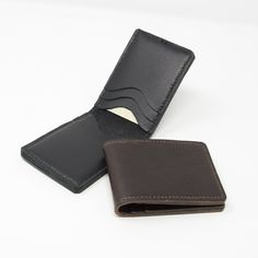 Leather bifold credit card holder with six individual card slots; choice of brown or black leather. This simple card holder is made from a combination of leathers.  The outer piece is a 2mm thick leather with a slightly textured finish.  The inner pockets are made from a thinner complimentary leather.  The card wallet is entirely hand-stitched using traditional saddle stitch and linen thread.  Edges are burnished to give a smooth finish.  Credit card holders measure approximately 213mm x 77mm op Brown Bifold Card Holder With Rfid Blocking, Brown Rfid Blocking Card Holder For Business, Classic Brown Trifold Card Holder, Brown Business Card Holder With Id Window, Classic Brown Card Holder With Rfid Blocking, Black Bifold Card Holder, Classic Brown Card Holder With Card Slots, Classic Brown Card Holder With Slots, Classic Brown Card Holder With Leather Lining