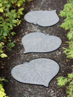 three leaf shaped stepping stones on the ground