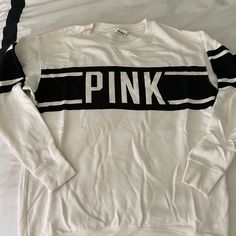 Brand New And Never Worn White T-shirt With Ribbed Cuffs For College, White Varsity Top With Ribbed Cuffs, White Graphic Print Sweater For Loungewear, White Logo Print Sweatshirt For Loungewear, White Cotton Varsity Sweater, Sporty White College Sweater, White Long Sleeve T-shirt Athleisure Style, White Long Sleeve Athleisure T-shirt, White Varsity Sweater For Streetwear