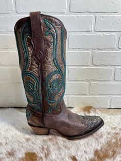 Check out this gorgeous new snip toe by Corral! Featuring a stunning brushed bronze color complete with delicate turquoise detailing and embroidery this boot is sure to stand out in a crowd! Snip Toe 13" Shaft Height 13.5" Circumference 2" Cowboy Heel Leather Sole Turquoise Western Boots With Snip Toe, Turquoise Leather Boots For Western-themed Events, Corral Shoe Boots Tall, Snip Toe Cowgirl Boots, Womens Western Hats, Womens Ball Caps, Brown And Turquoise Cowboy Boots, Corral Boots Womens, Mens Work Shoes