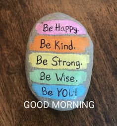 a painted rock with the words be happy, be kind and be strong