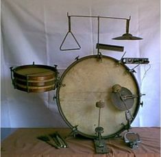 an old drum sits on top of a table