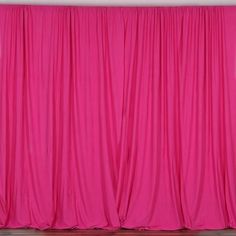 the pink curtains are closed up and ready to be used as backdrop for an event