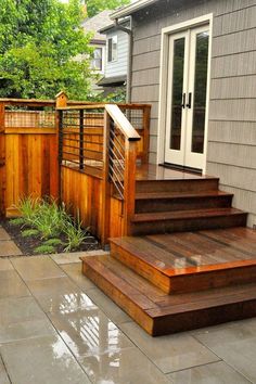 a wooden deck with steps leading up to it