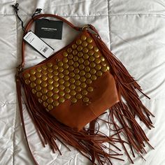 Has Some Light Scuffing On One Side From Just Being Stored But Has Never Been Used Or Worn Out. Beautiful Cognac Leather Color And Can Be Worn 2 Ways! As A Shoulder Bag Or Crossbody. Comes With Original Tags. Leather Satchel With Snap Closure For Errands, Leather Shoulder Bag With Snap Closure For Errands, Leather Hobo Bag With Snap Closure For Shopping, Leather Hobo Bag With Snap Closure For Errands, Leather Bag With Snap Closure For Errands, Leather Bucket Bag With Snap Closure For Shopping, Leather Shoulder Bag With Snap Closure For Shopping, Brown Leather Bucket Bag With Metal Hardware, Leather Bucket Hobo Bag With Snap Closure