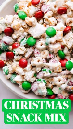 a white bowl filled with candy and marshmallows on top of a table