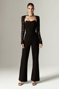 If you loved our Veva Dress , you'll love our jumpsuit version in 'Marisol’. It's cut from a soft Ponte de Rama stretch fabric and has a figure hugging silhouette to accentuate your curves. This version has a classic back hue that sets the tone for your most glamorous events and features a figure cinching boned bodice with the prettiest Guipure lace trim peeking from the neckline and sleeves.This specially developed Ponte De Roma fabric is soft with plenty of stretch and has a gorgeous Matt feel Jumpsuit Sleeves Design, Soft Dramatic Jumpsuit, Suit With Corset Top, Corset Jumpsuit Outfit, Casual Event Outfit, Jumpsuit Soiree, Prom Romper, Graduation Fits, Simple Lace Dress