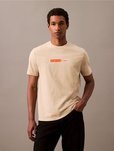 Crafted from 100% cotton, this t-shirt is soft and breathable, perfect for everyday wear. Styled with short sleeves and a crewneck. Cut in a classic fit and features a printed graphic at the front.  Material: 100% Cotton. Basic Crew Neck Calvin Klein T-shirt, Basic Calvin Klein Crew Neck T-shirt, Calvin Klein Relaxed Fit Crew Neck T-shirt, Calvin Klein Crew Neck T-shirt For Spring, Calvin Klein Everyday Summer Tops, Calvin Klein Graphic Tee With Crew Neck, Calvin Klein Graphic Tee Crew Neck, Calvin Klein Relaxed Fit Casual T-shirt, Calvin Klein Tops For Everyday Summer Wear