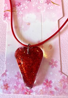 Beautiful  Handmade  Sparkling glitter red resin heart on  matching red waxed cord chain. ❤️❤️❤️ 100% handmade and designed by butterfly boutique X And  Beautifully unique, no two resin pieces will ever be exactly the same! ⭐️⭐️⭐️⭐️⭐️ Only one available.  Price includes item and U.K. postage fees.  Thanks for looking. Red Heart Necklace For Valentine's Day Party, Handmade Red Heart Necklace For Valentine's Day, Adjustable Red Heart Necklace Gift, Red Adjustable Heart Necklace As A Gift, Adjustable Red Heart Necklace For Gift, Adjustable Red Heart Necklace As A Gift, Cute Red Necklace With Heart Charm, Cute Red Necklace With Heart Beads, Cute Red Heart Pendant Necklace