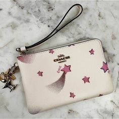 Brand New, Never Used Coach Wristlet. Beautiful Crme Color Coated Canvas With Vibrant Pink Stars And A Corner Zip Closure. Crme Color Strap With Gold Hardware. Two Fun Detachable Charms To Switch Up The Look. One Is Two Martini Glasses (One Gold And One Silver) With A Tiny Rhinestone On The Gold Glass And One Is The Signature Coach “C” In Gold. Perfect For A Giftable Item Too! Triangle Body Shape, Fashion Closet, Creme Color, Martini Glasses, Pretty Bags, Coach Wristlet, Pink Stars, Bday Ideas, Gold Glass