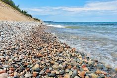 the beach is covered with rocks and water