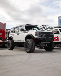 two large trucks parked next to each other