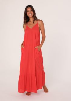 [Color: Flame] A front facing image of a brunette model wearing a simple flowy sleeveless maxi tank dress in a bright red crinkle rayon. With a v neckline in front and back Casual Maxi Length Sundress Unlined, Casual Unlined Maxi Sundress, Breezy Rayon V-neck Maxi Dress, Breezy Maxi Dress With Adjustable Straps, Casual Flowy Unlined Maxi Dress, Casual Solid Maxi Dress With Adjustable Straps, Casual Sleeveless Dress With Crinkle Texture, Breezy Flowy Maxi Dress With Spaghetti Straps, Flowy Solid Sundress With Spaghetti Straps