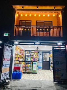 the entrance to a grocery store at night