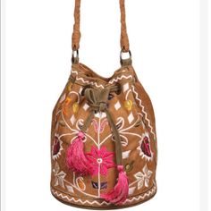 This Drawstring Hobo Bucket Bag Is Super Cute! This Design Lends Itself To A More Casual Dress Of Your Favorite Bohemian Looks. The Embroidery Is Playful And Fun And The Suede Pull Strings Have Fun Tassels To Complete The Look. 11” X 9.5” X 7” Tan Sueded Fabrication With Olive Draw Strings Colorful Embroidery Colorful Embroidery, Bohemian Look, Embroidered Bag, Have Fun, Drawstring Backpack, Bucket Bag, Tassels, Casual Dress, Bag Lady